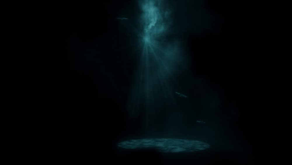 Mysterious underwater light beam illuminating ocean floor Background