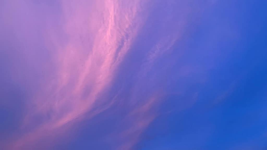 Free-Abstract-Purple-Sky-Pink-Cloud-Background Abstract purple sky with soft pink clouds sweeping across a blue twilight sky background