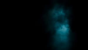 Mysterious blue mist on dark background with glowing effect