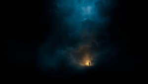 The background of Person a standing alone in mysterious fog with light